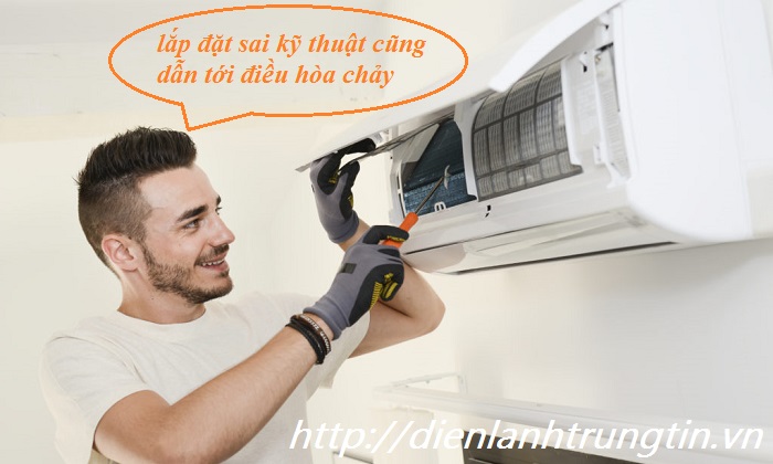 handsome young man electrician installing air conditioning in a client house